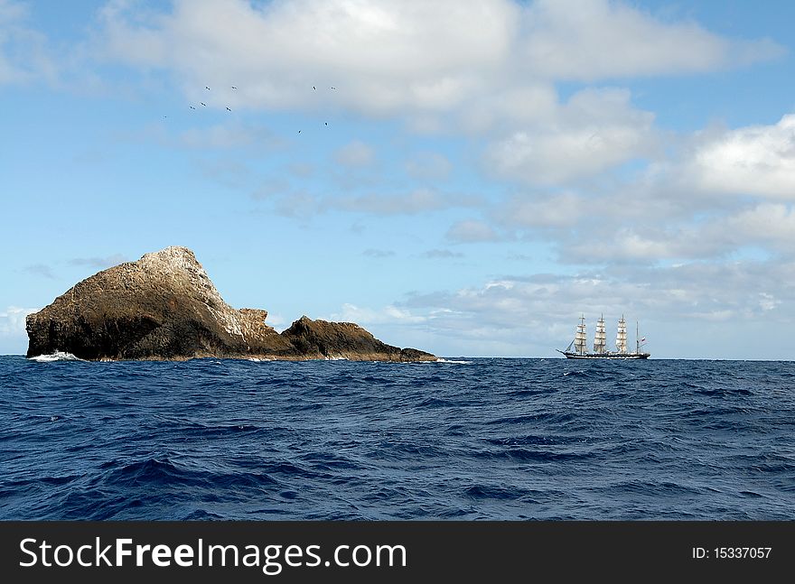 The sailing ship against islands