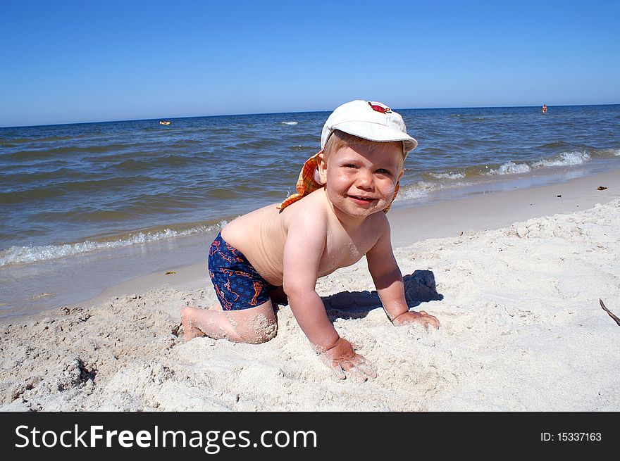Small boy over sea, fun on beach
