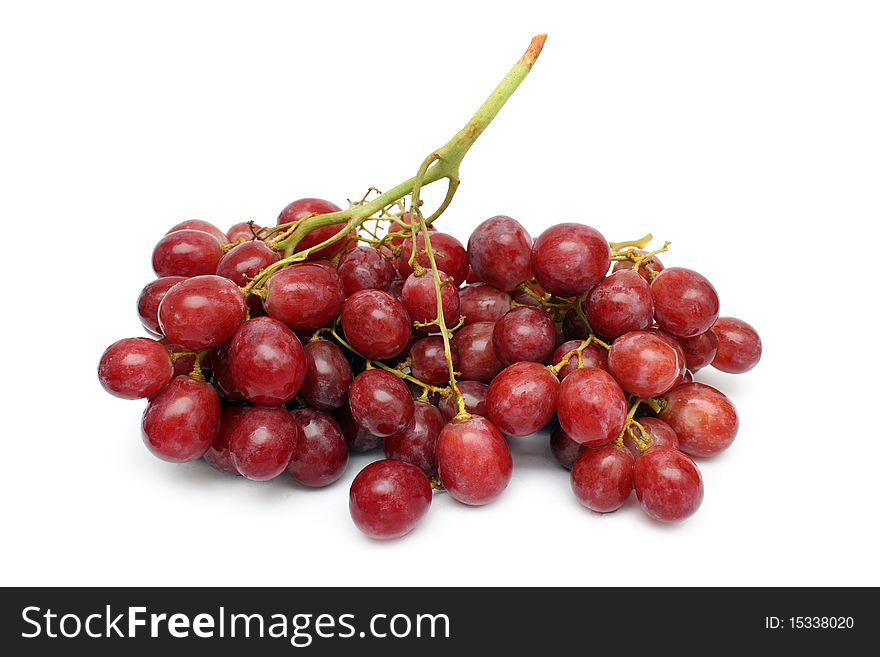 A string of red grape isolated on white background.