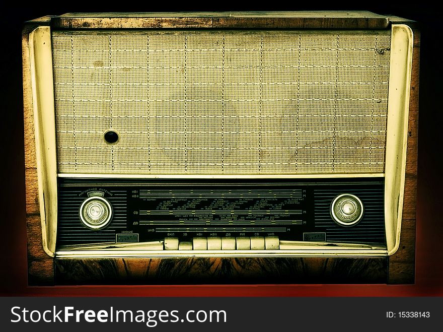 Old russian radio isolated on a dark background. Old russian radio isolated on a dark background