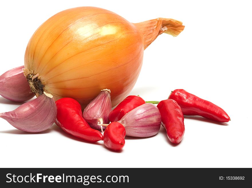 Onion garlic and red pepper on a white background. Onion garlic and red pepper on a white background.