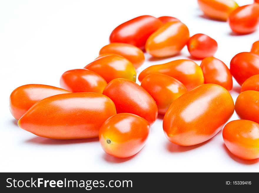 Many small tomato on white background