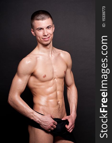 Muscled male model posing in studio