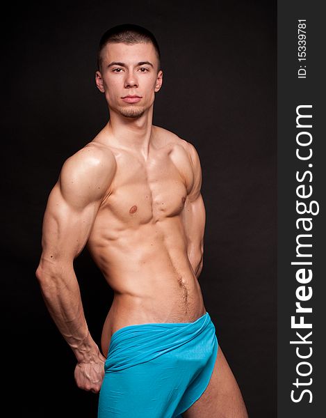 Muscled male model posing in studio