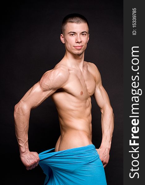 Muscled male model posing in studio