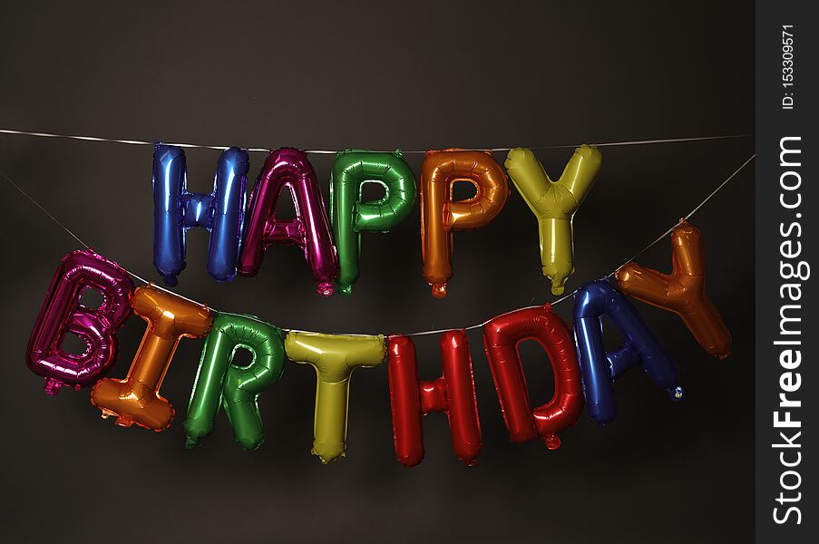 Phrase HAPPY BIRTHDAY made of colorful balloon letters