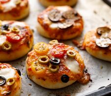 Small Vegetarian Pizzas With The Addition Various Kinds Of Vegetables And Mozzarella Cheese And Fresh Basil Stock Photos Small Vegetarian Pizzas With The Addition Various Kinds Of Vegetables And Mozzarella Cheese And Fresh Basil Stock Photos