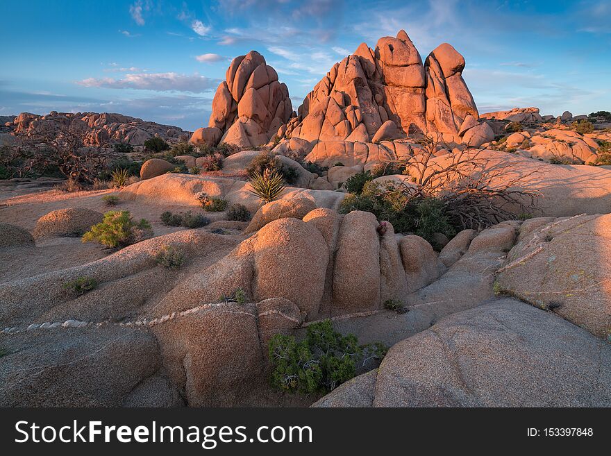 Joshua Tree National Park, Mojave Desert, California, USA. Jumbo rocks at sunset. Beautiful landscape background.