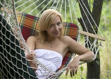 Portrait Of A Smiling Girl Lying In A Hammock Royalty Free Stock Image