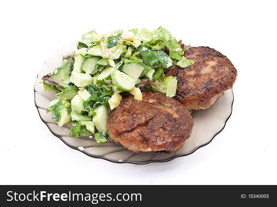 Cutlets with salad on white