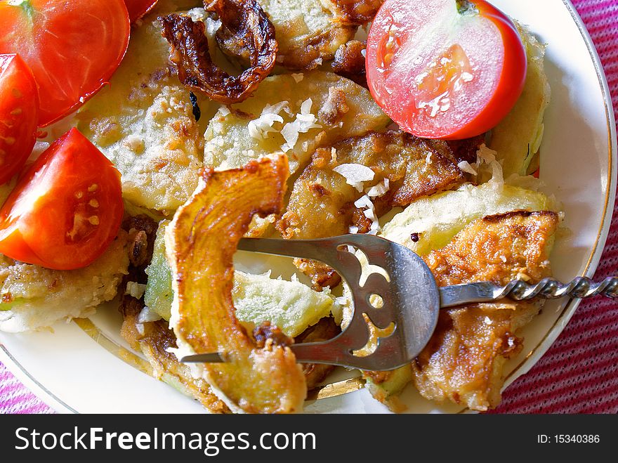 Appetizing fry garden marrow with garlic seasoning