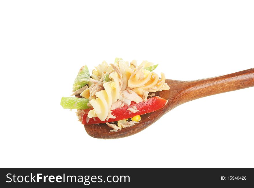Pasta in a wooden spoon isolated against white