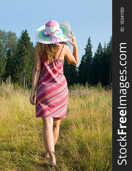 Young attractive woman is walking barefoot