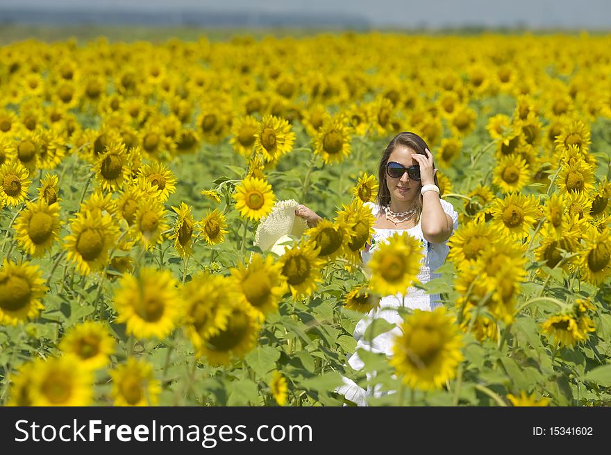 Beautiful Woman On Sunflower Field