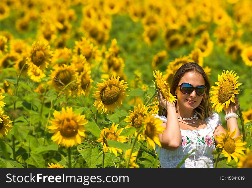 Beautiful Woman On Sunflower Field