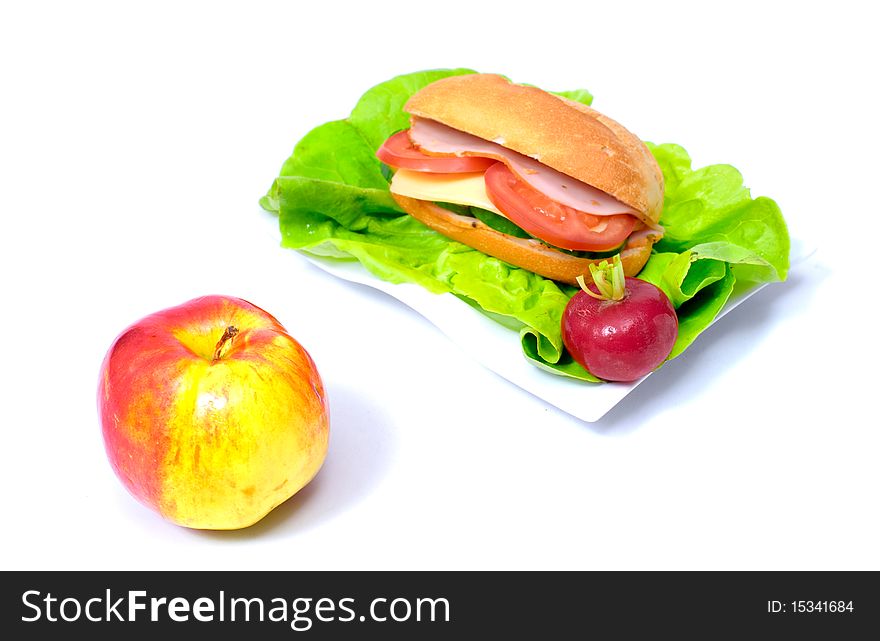 Big sandwich and a ripen apple