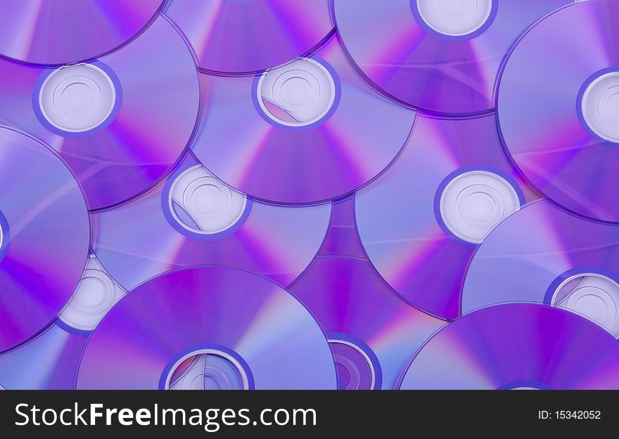 A background consisting of layer of СD disks. A background consisting of layer of СD disks