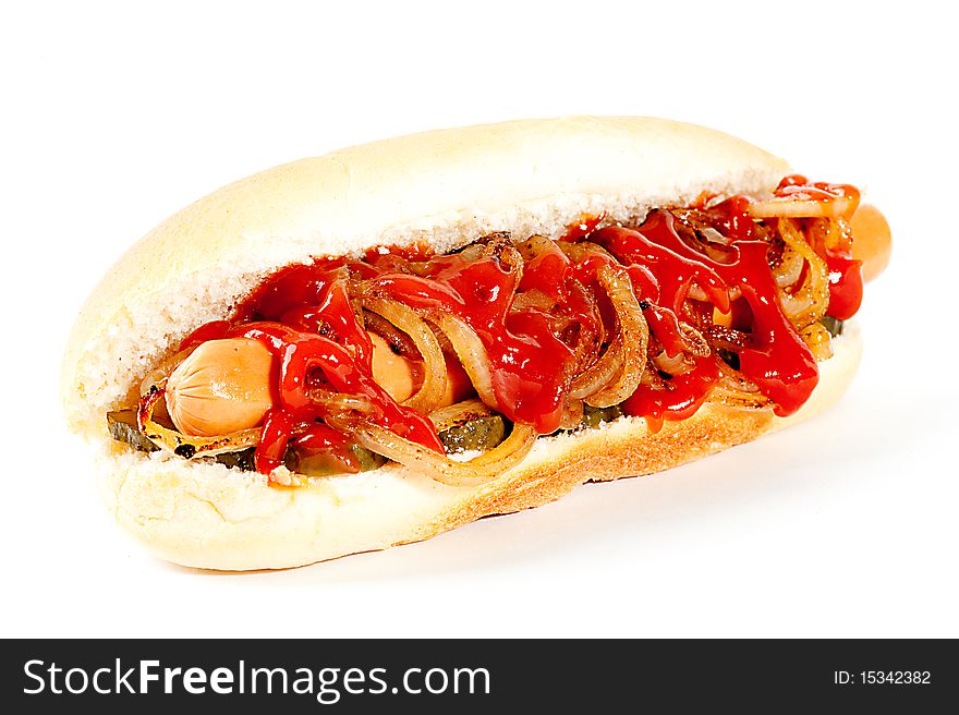 Hot dog with ketchup and roasted onions