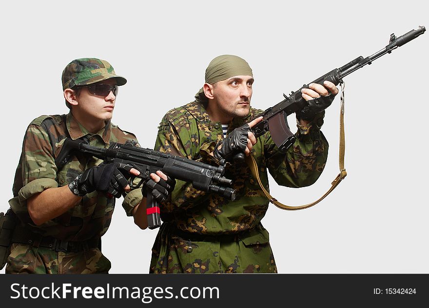 Portrait of soldiers with an automatic assault rifles