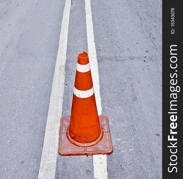 Orange Traffic cone on road. Orange Traffic cone on road