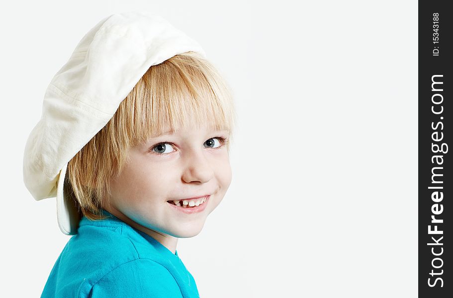 Portrait boy in cap on a light  background