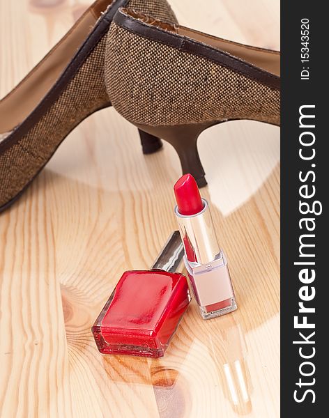 Cute pair of shoes with red cosmetics. Cute pair of shoes with red cosmetics