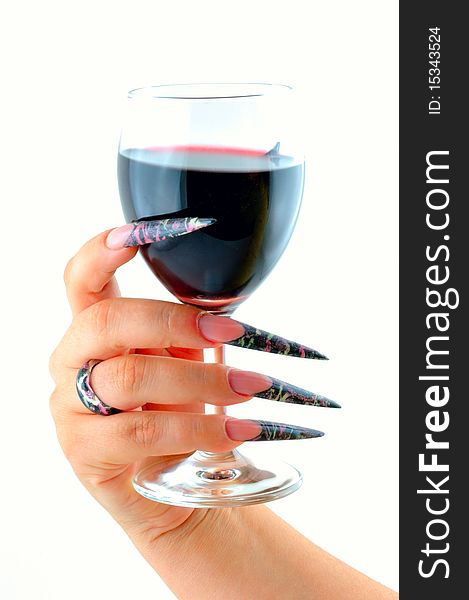 Woman's hand holding nail graft in a glass of wine. Woman's hand holding nail graft in a glass of wine
