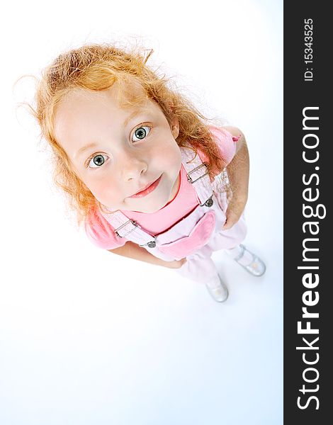 Portrait of a cute red-haired girl. Isolated over white background.