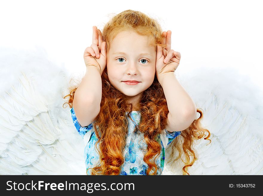 Portrait of a cute red-haired girl angel. Isolated over white background. Portrait of a cute red-haired girl angel. Isolated over white background.