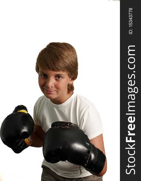 The boy in boxing gloves on a white background . The boy in boxing gloves on a white background .