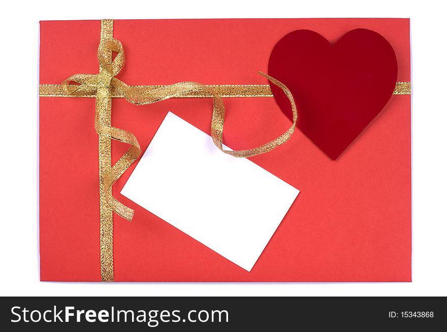 Red blank note and golden ribbon isolated on white background for Valentine's Day