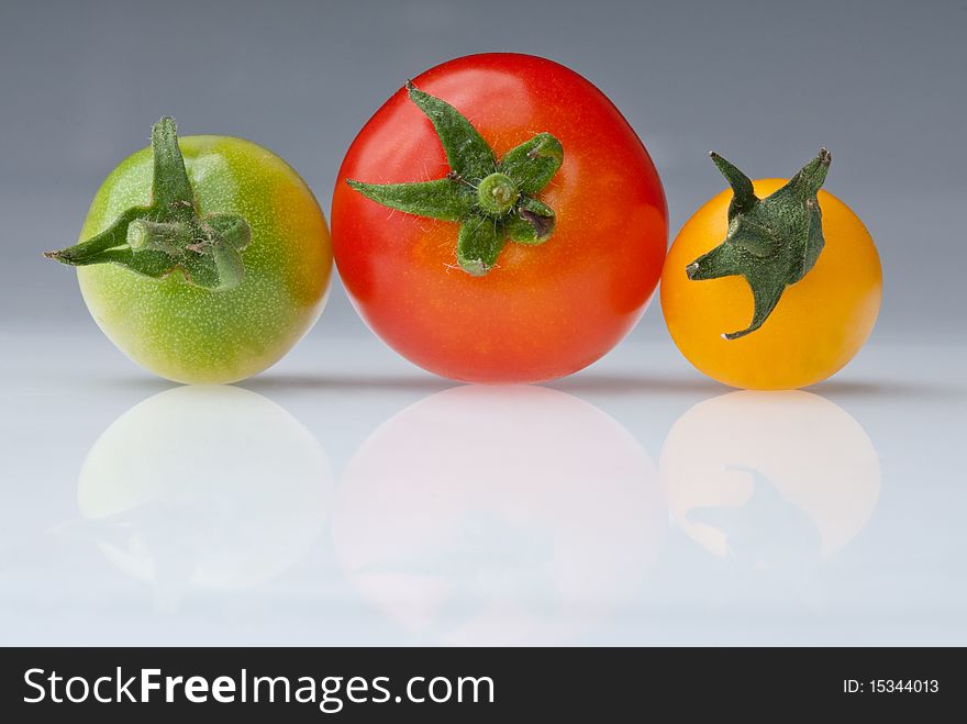 Tricoloured cherry tomato, red, yellow and green. Tricoloured cherry tomato, red, yellow and green.