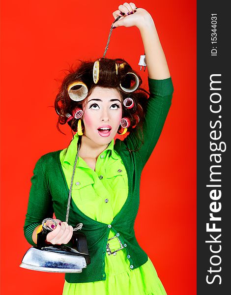 Shot of a funny  woman housewife dressed in retro style. Shot of a funny  woman housewife dressed in retro style.