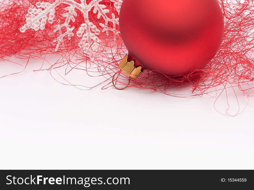 Red bauble with white snowflake on a white background. Red bauble with white snowflake on a white background.