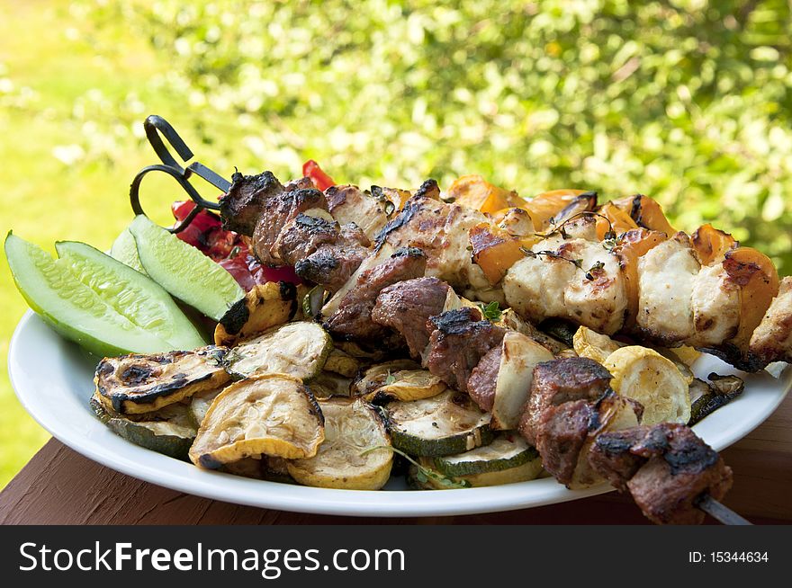 Summer delicious shish kabobs and grilled vegetables.