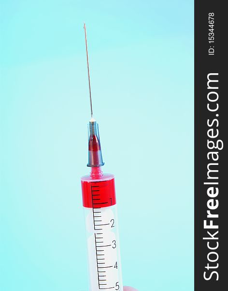 Photo of Medical Syringe on blue  background