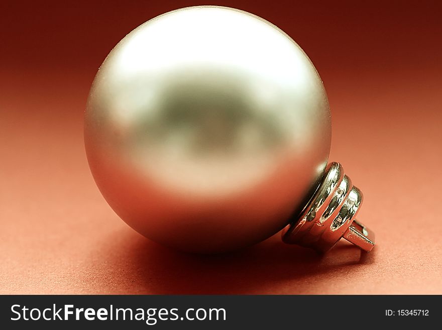 Closeup of a Christmas tree ornament on red. Closeup of a Christmas tree ornament on red