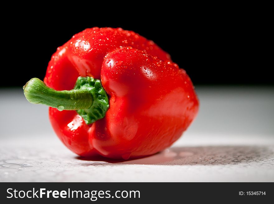 Still life shooting, red sweet pepper sprayed with water