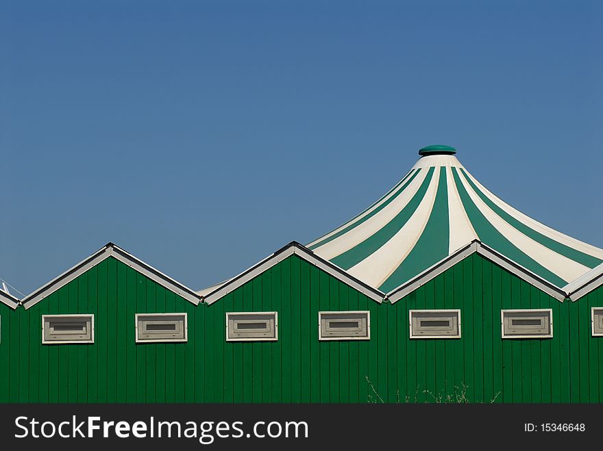 Green and white wooden cabins