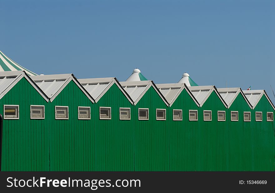 Green and white wooden cabins