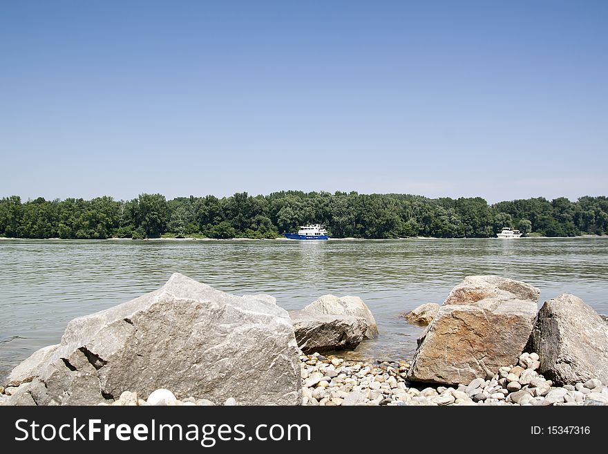 Donau River With Boat And Rocks