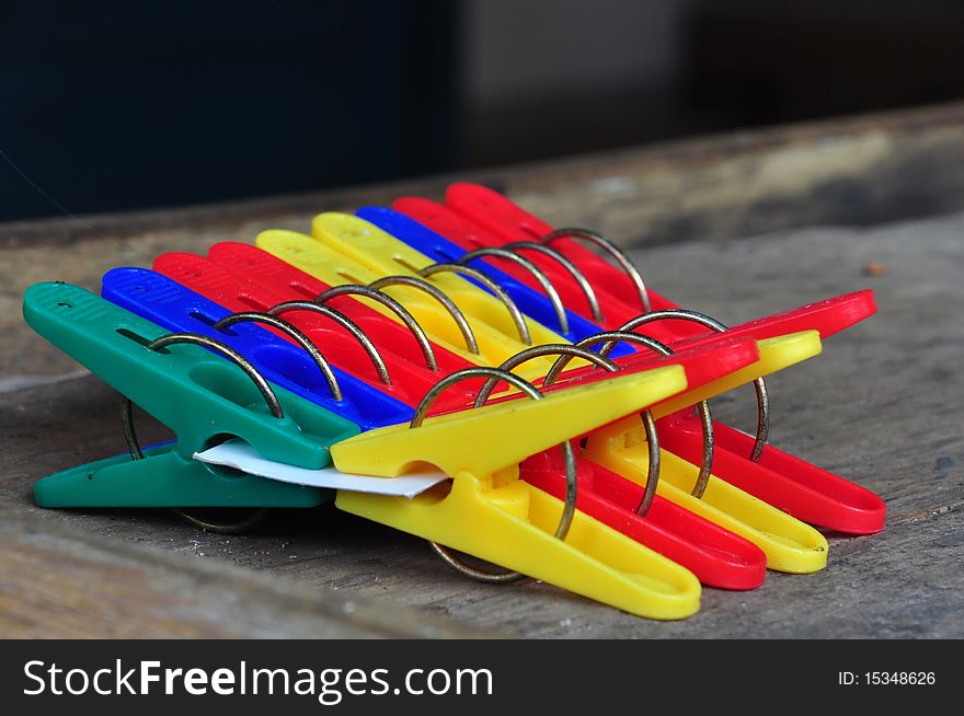 Colorful clothespin or pegs on the table. Colorful clothespin or pegs on the table.