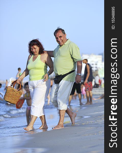 Happy Seniors Couple  On Beach