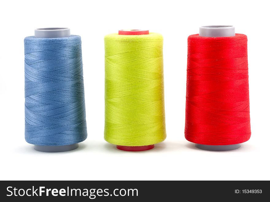 Selective focus image of stack of coloured sewing thread. Selective focus image of stack of coloured sewing thread