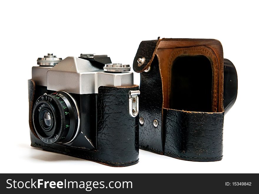 Old manual film camera and bag isolated on white