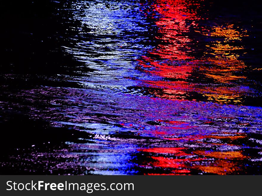 Blurred Colorful Light Reflection On River Surface