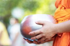 Monk With Hand Holding Give Alms Bowl Which Came Out Of The Offerings In The Morning At Buddhist Temple, Culture Heritage Site Tra Stock Images