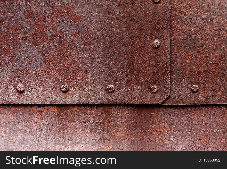 Old flat metal with pitting, rust and rivets. Old flat metal with pitting, rust and rivets.