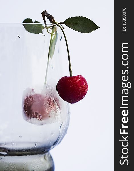 Transporant wineglass with red cherry. Transporant wineglass with red cherry.