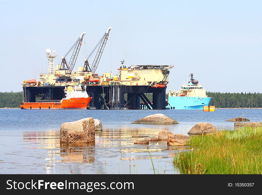 The image of floating pipelayer works at the construction of underwater pipeline